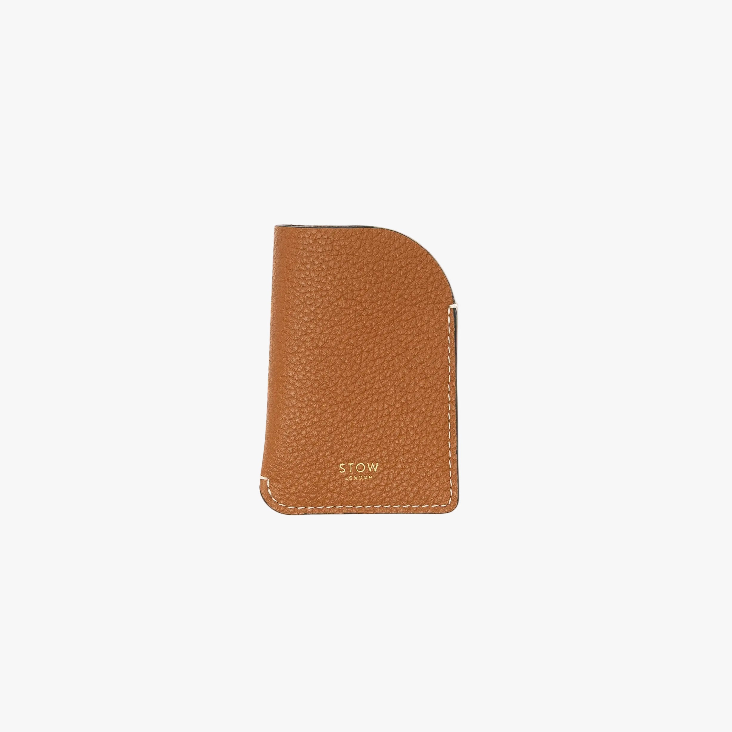STOW London's Mini Cardholder in Earth Tan pebbled leather on a light grey background featuring a small gold embossed logo on the front bottom 