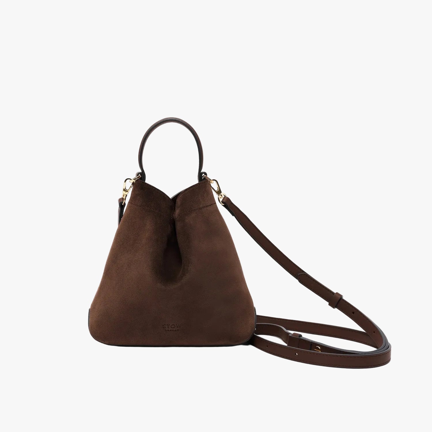 STOW London's Mini Curve in Chocolate suede leather and detachable leather crossbody strap on a light grey background 