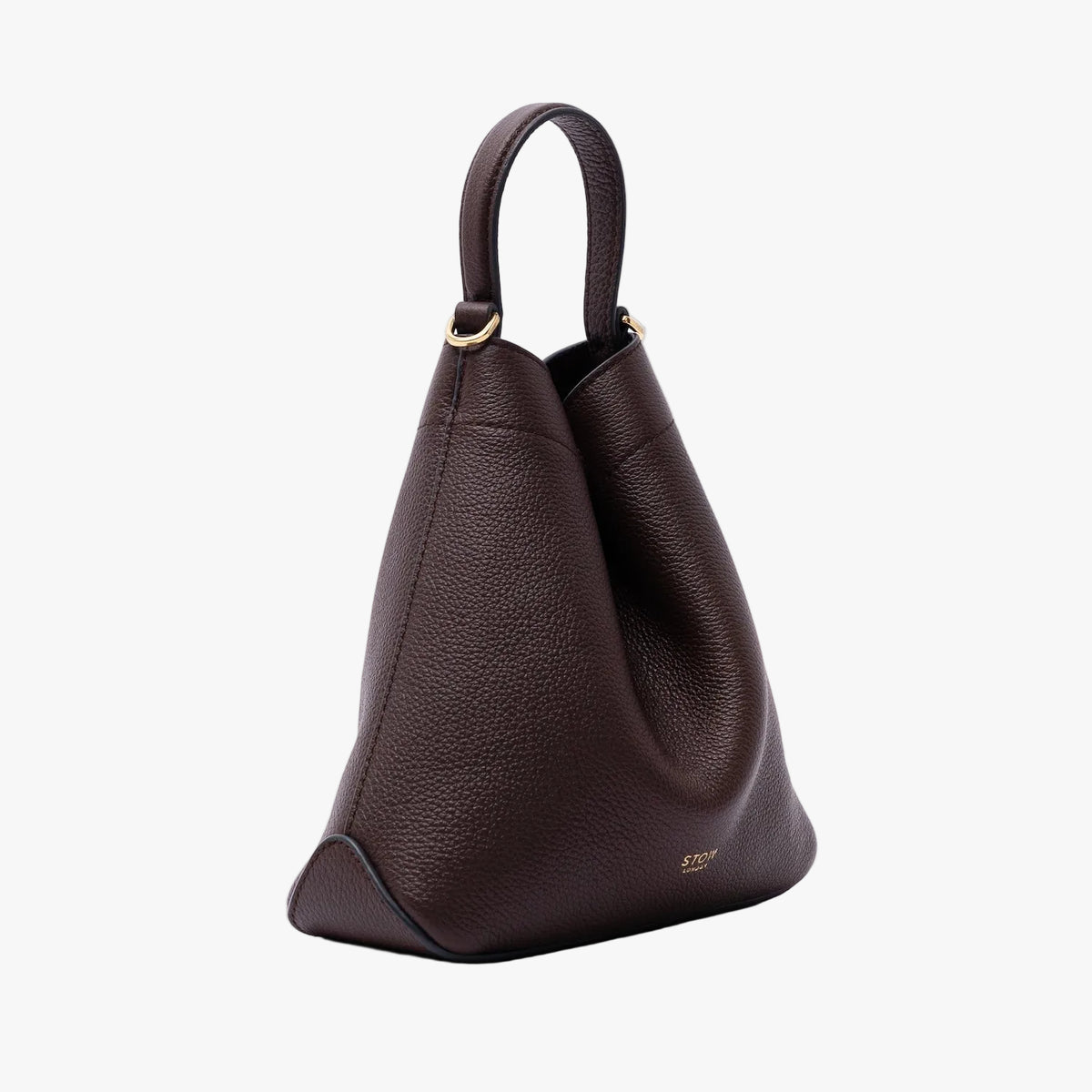 Off-axis view of STOW London's Mini Curve in Espresso pebbled leather on a light grey background featuring gold-coated stainless steel hardware