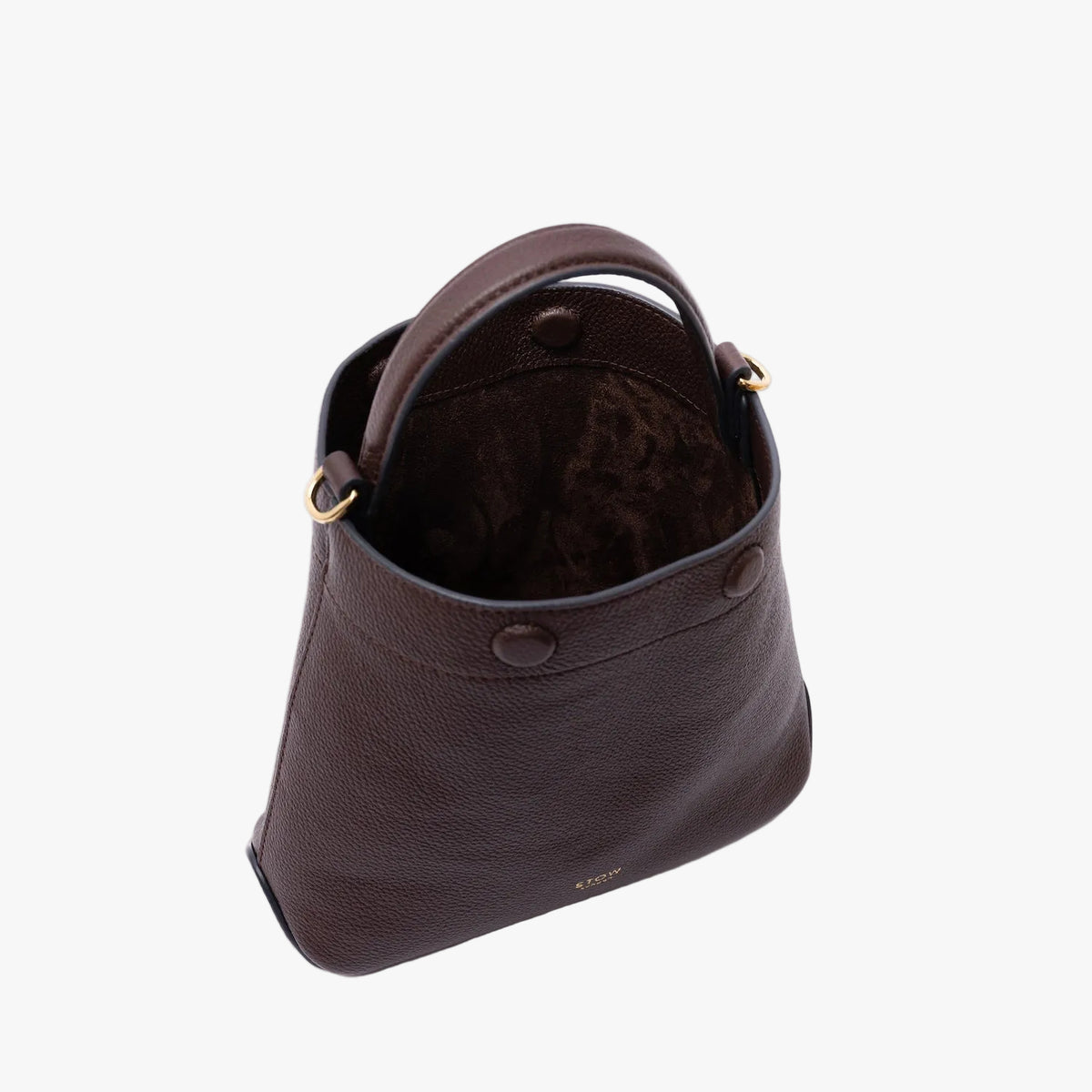 Top view of STOW London's Mini Curve in Espresso pebbled leather on a light grey background with magnets open showing the chocolate suede interior 
