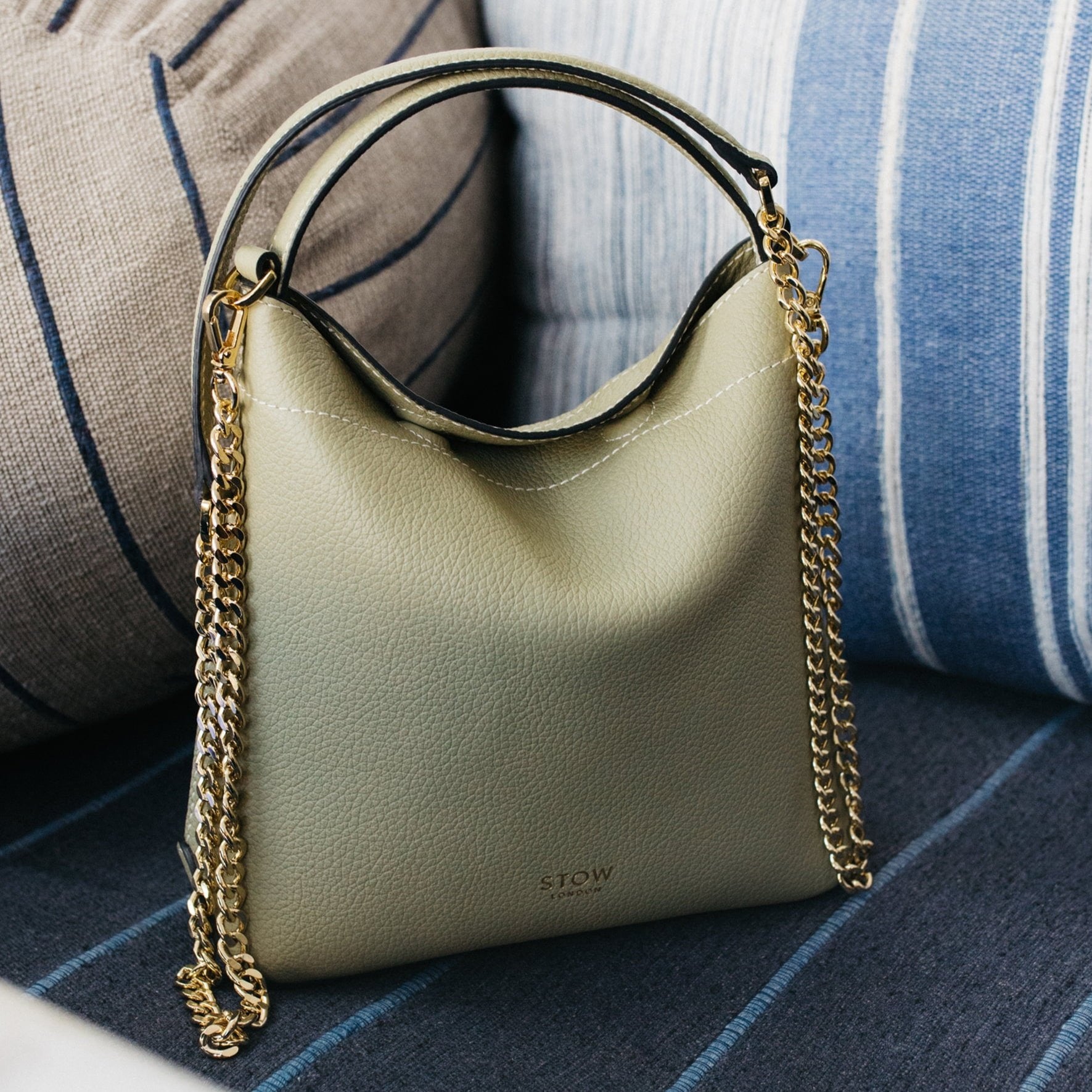 STOW London Mini Curve Bag in Pale Green leather in Tangiers photo shoot.