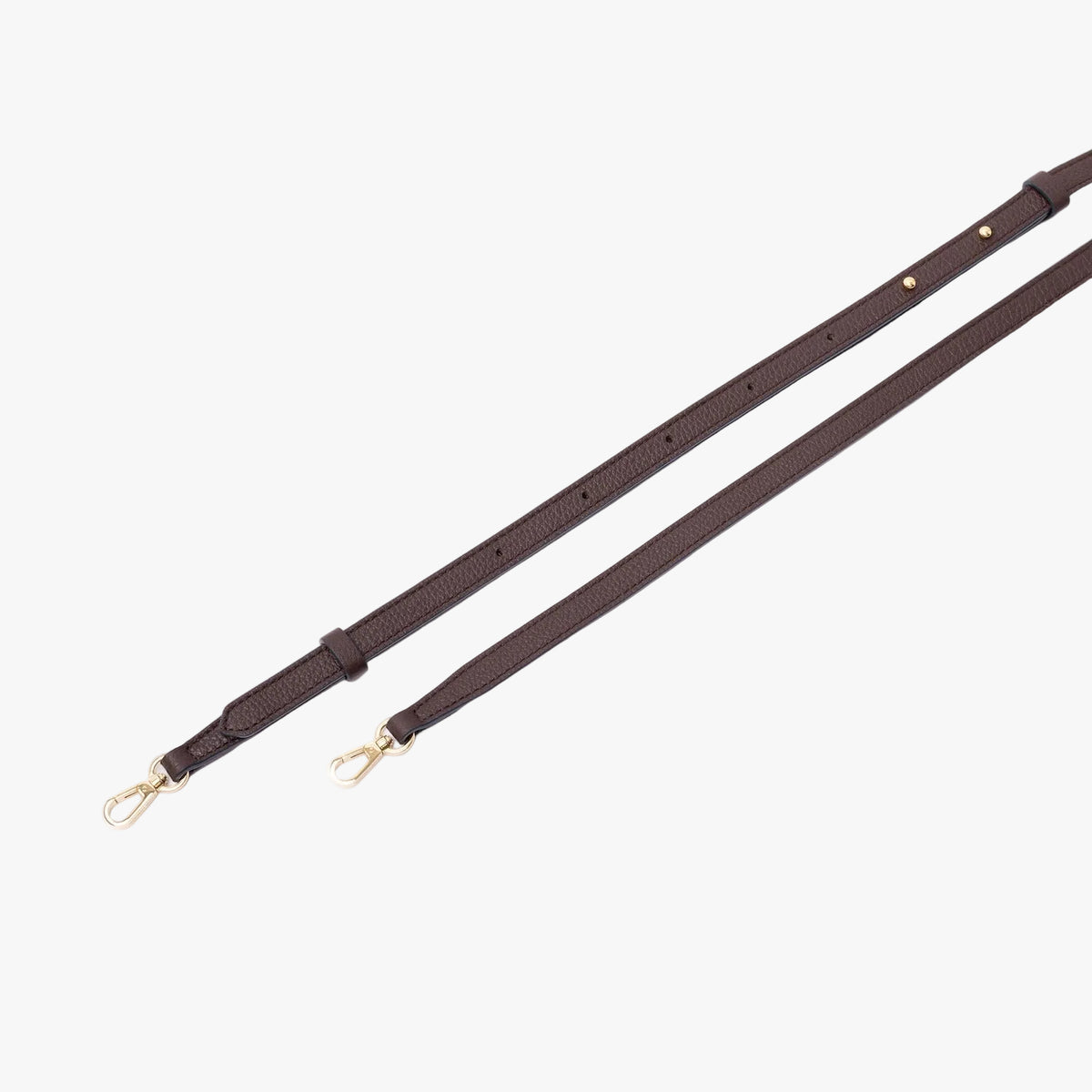 The detachable crossbody strap for the Mini Curve featuring gold-coated stainless steel hardware