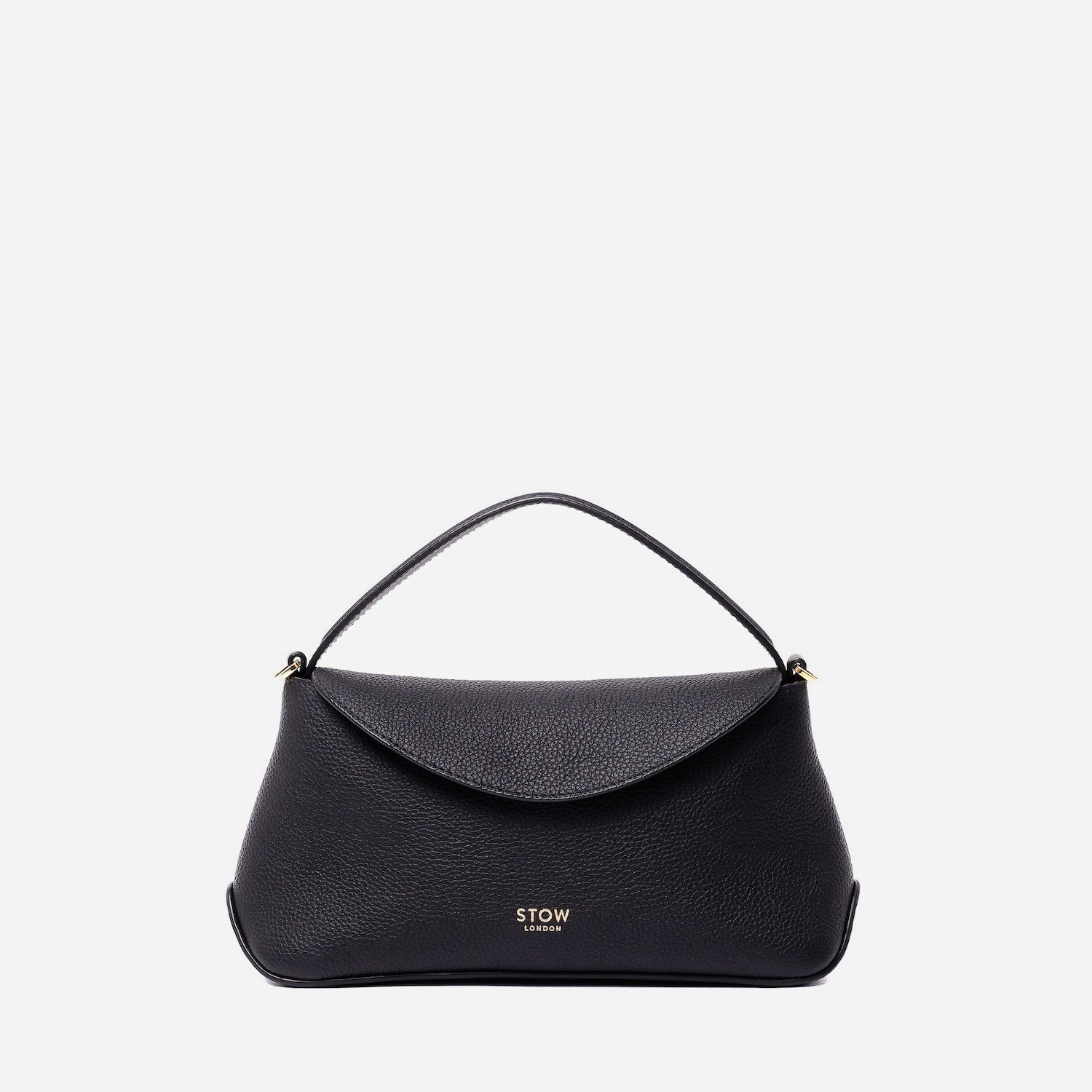 STOW London's Mini East West in Black pebbled leather featuring gold-coated stainless steel hardware on a light grey background