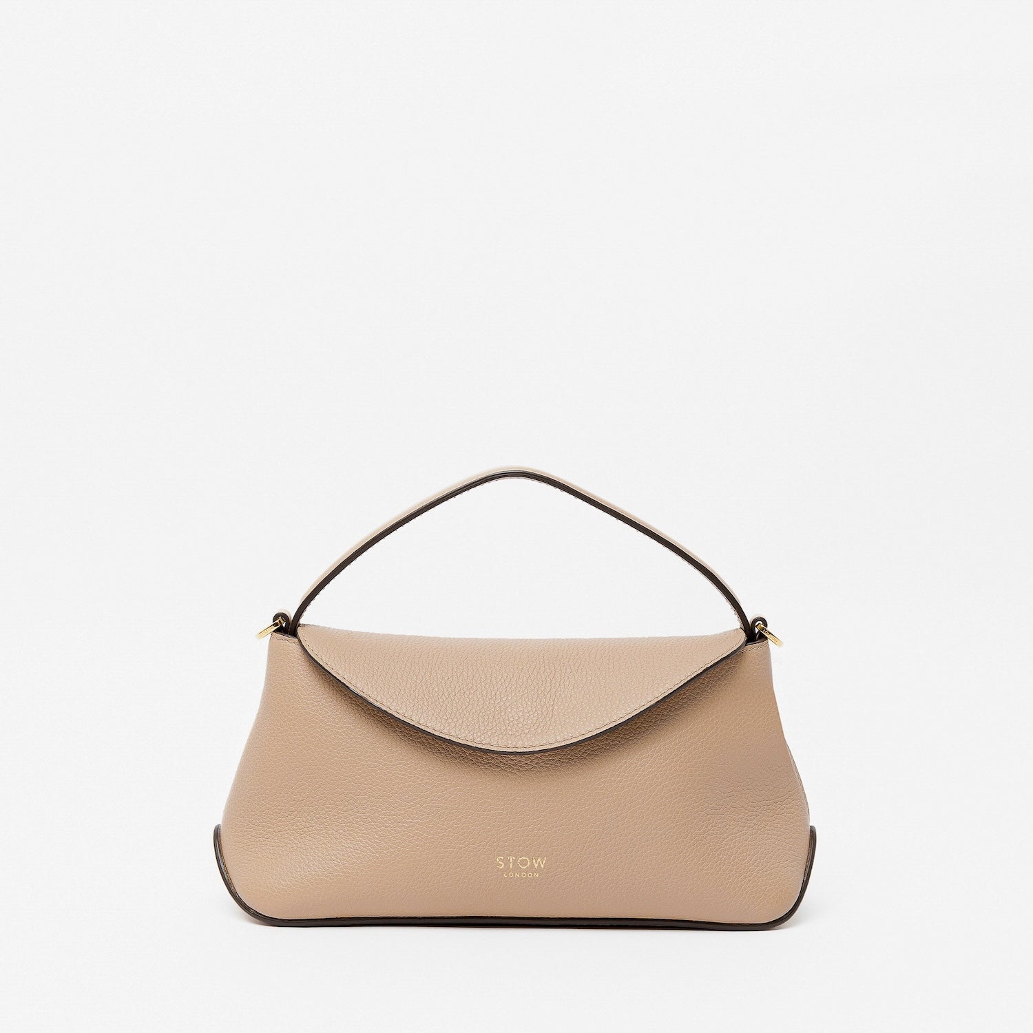 STOW London's Mini East West in Camel pebbled leather featuring gold-coated stainless steel hardware on a light grey background