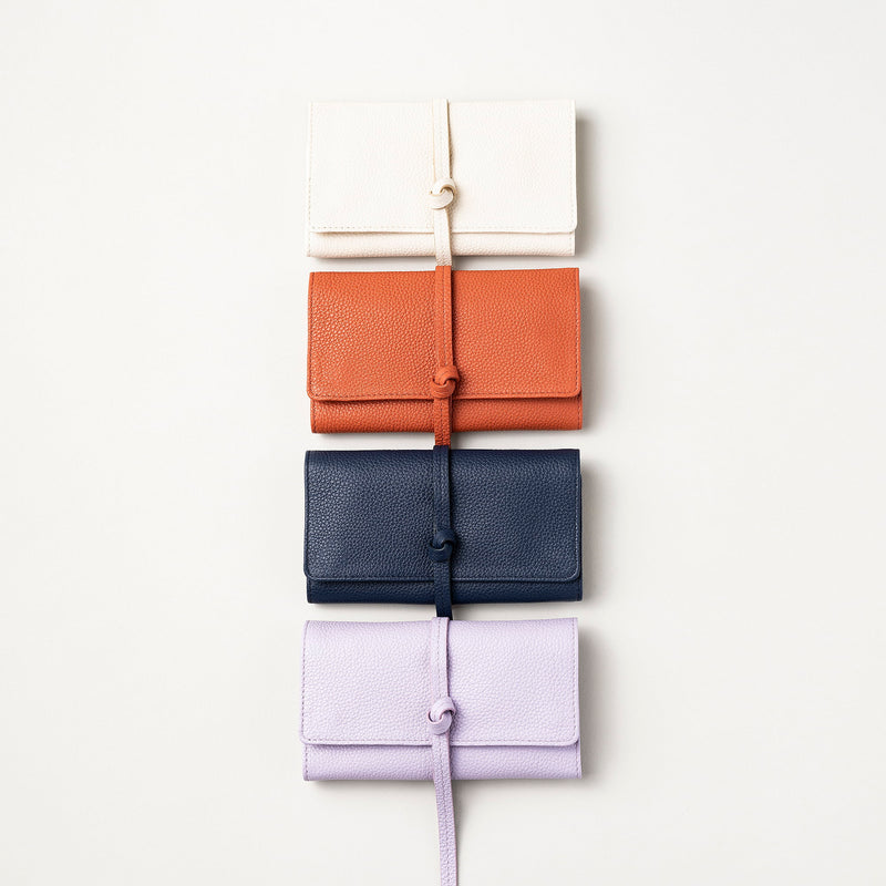 STOW Mini Jewellery Rolls in Clay Orange, Navy, Spring Moon and Wild Lavender colours.