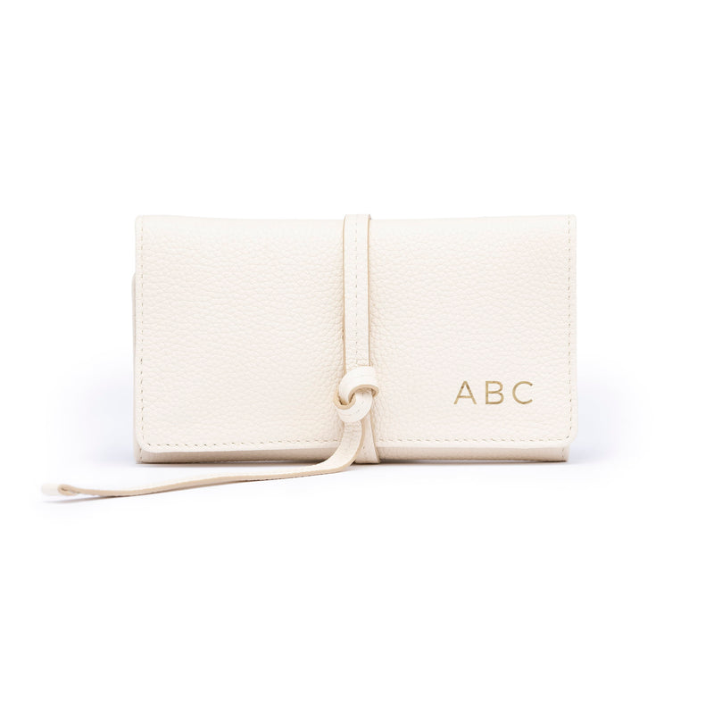 STOW London Mini Jewellery Roll in Spring Moon leather with personalised initials on flap.