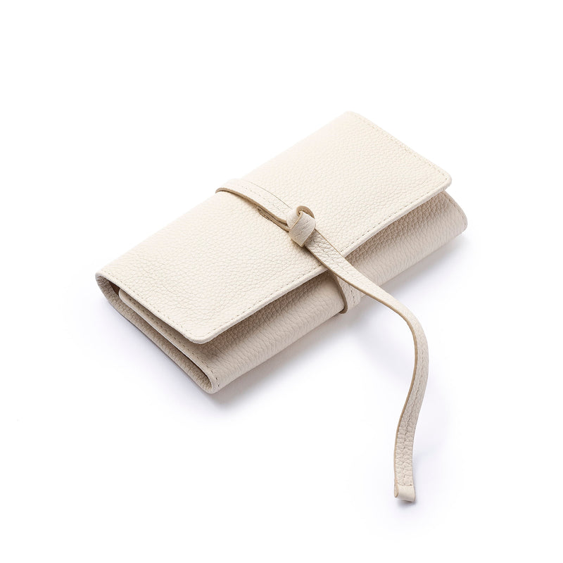 STOW Mini Jewellery Roll in Spring Moon pebbled leather closed with leather tie.