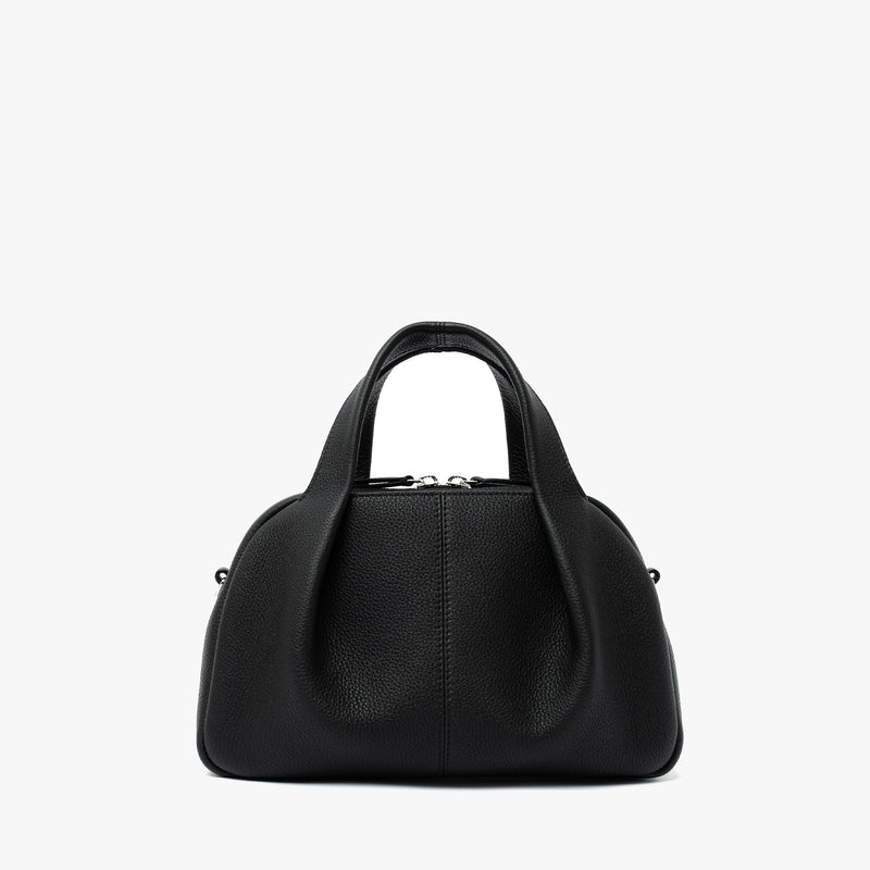 STOW London's Mini Bowling bag in Black pebbled leather featuring a pleated front panel and silver stainless steel hardware on a light grey background