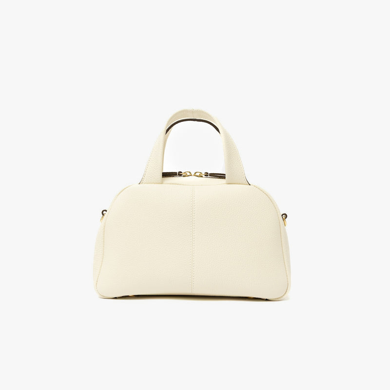 Back panel of STOW London's Mini Bowling bag in Spring Moon pebbled leather featuring gold-coated stainless steel hardware on a light grey background