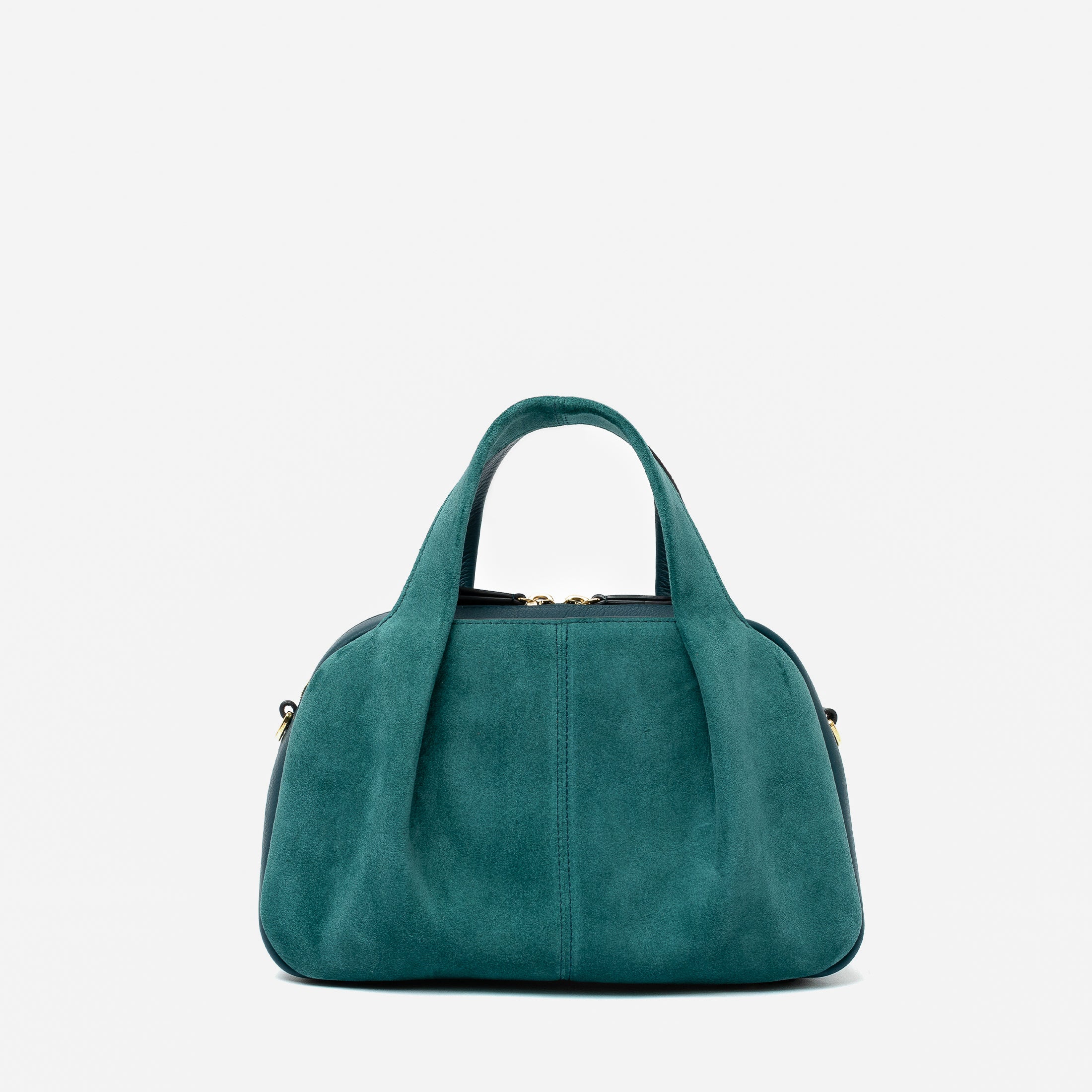 STOW London's Mini Bowling bag in Ocean Teal suede and smooth leather featuring a pleated front panel and gold-coated stainless steel hardware on a light grey background