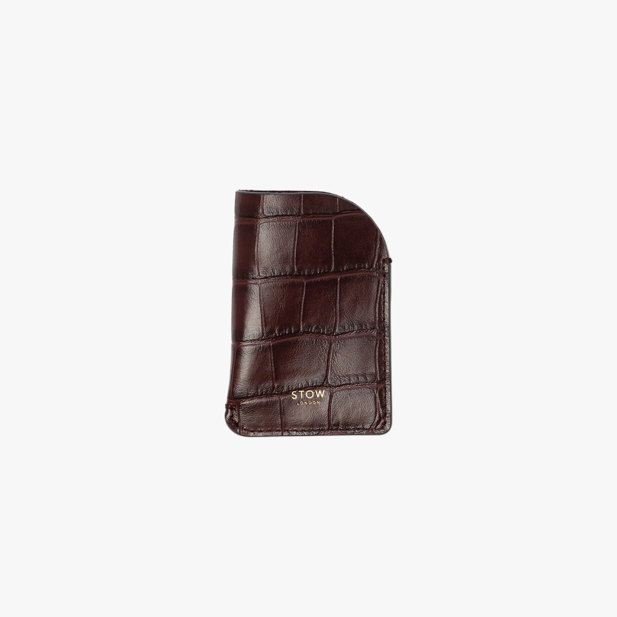 STOW London's Mini Cardholder in Burgundy Embossed Croc leather on a light grey background featuring a small gold embossed logo on the front bottom