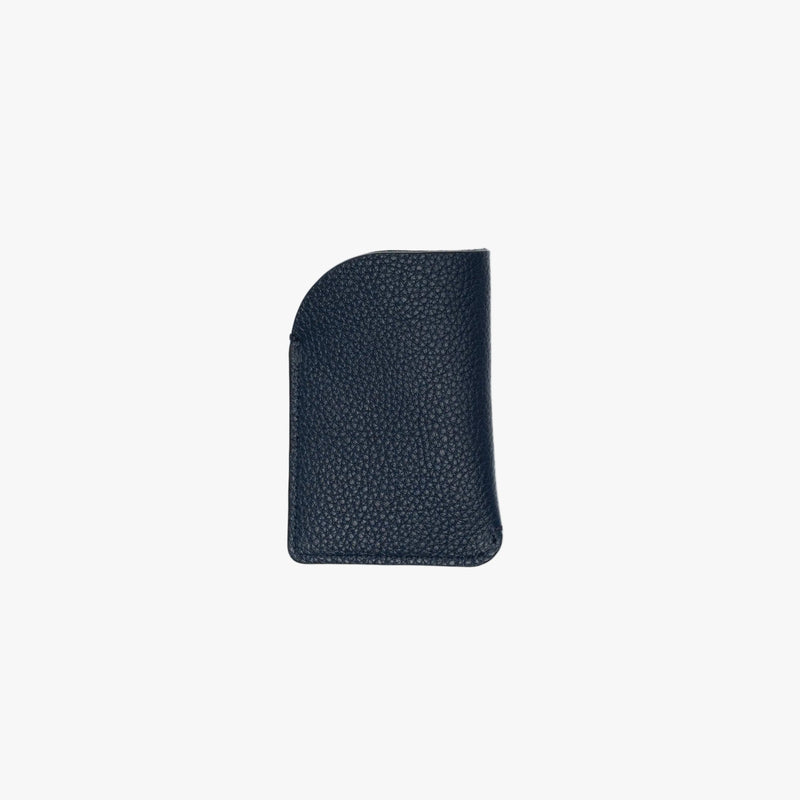 Back panel of STOW London's Mini Cardholder in Navy pebbled leather on a light grey background 