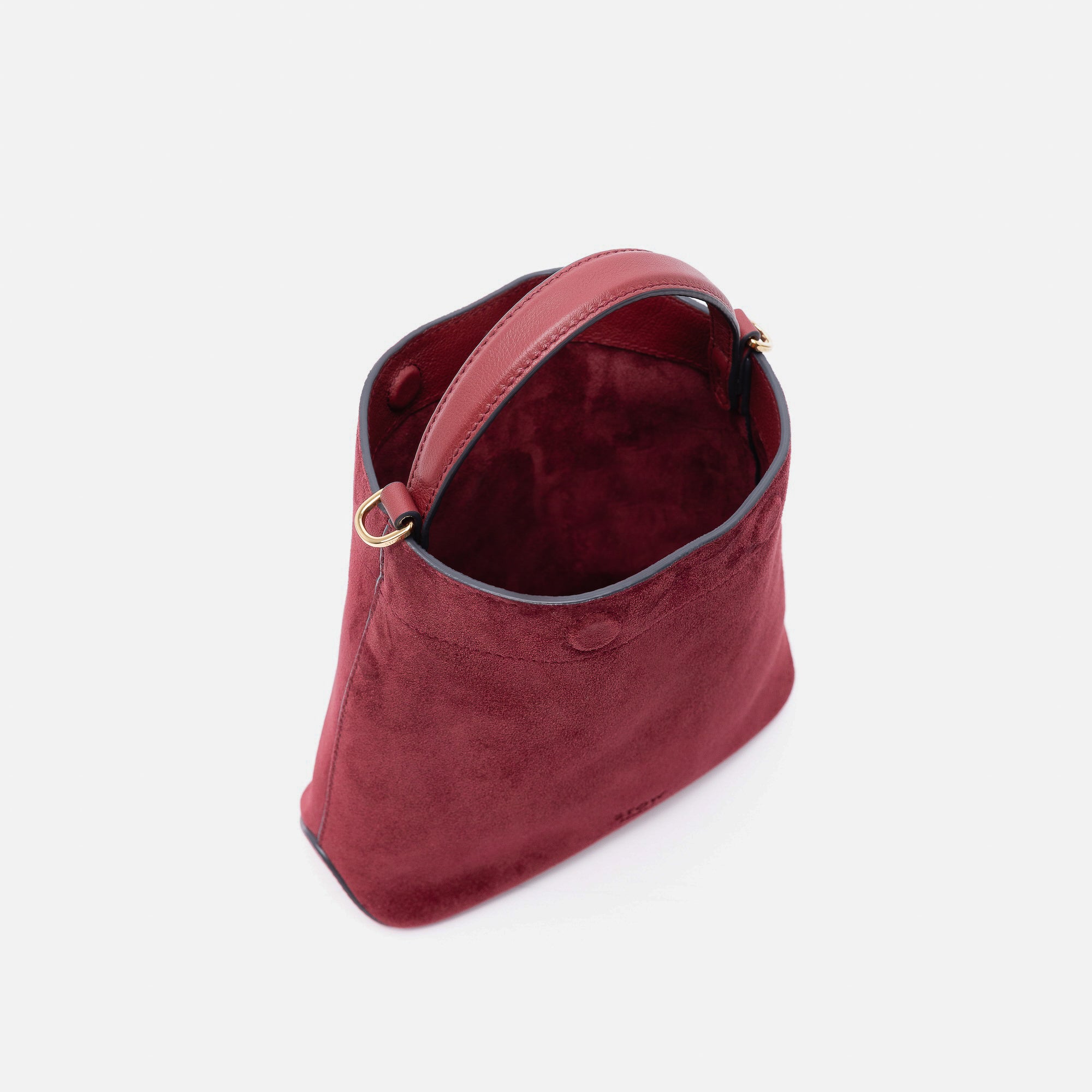 Stow London's Mini Curve in Burgundy suede leather with magnets open showing burgundy suede lining on a light grey background 