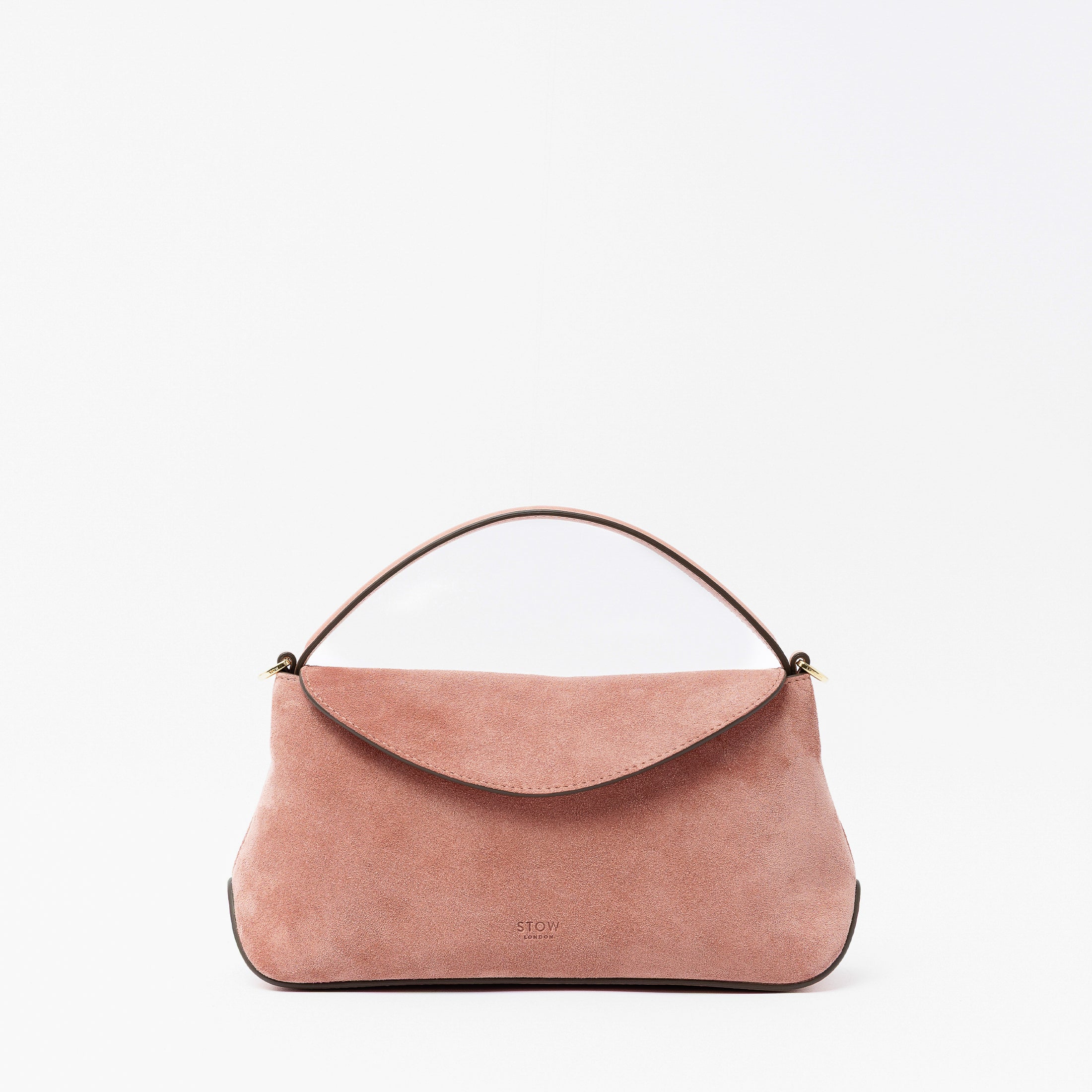 STOW London's Mini East West in Hazy Blush suede leather featuring gold-coated stainless steel hardware on a light grey background