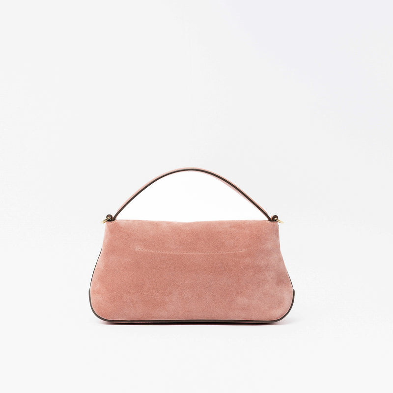 Back panel of STOW London's Mini East West in Hazy Blush suede leather featuring gold-coated stainless steel hardware on a light grey background