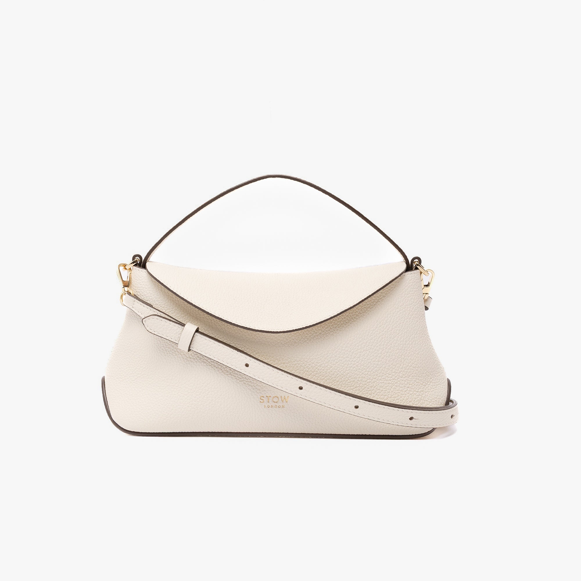 STOW London's Mini East West in Spring Moon pebbled leather and detachable crossbody strap featuring gold-coated stainless steel hardware on a light grey background