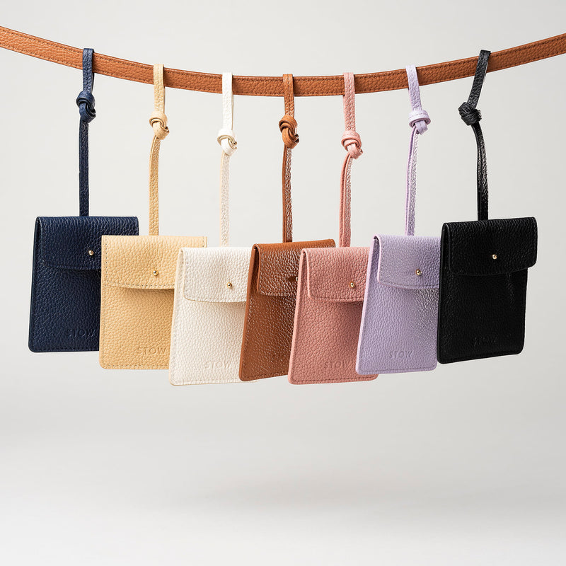STOW London Leather Multi Tag in various colours hanging on a line together.