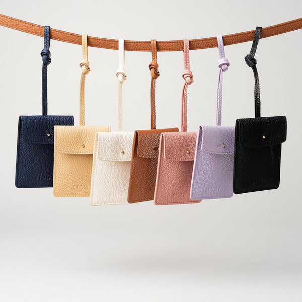 STOW Leather Multi Tag in various colours hanging on a line together.