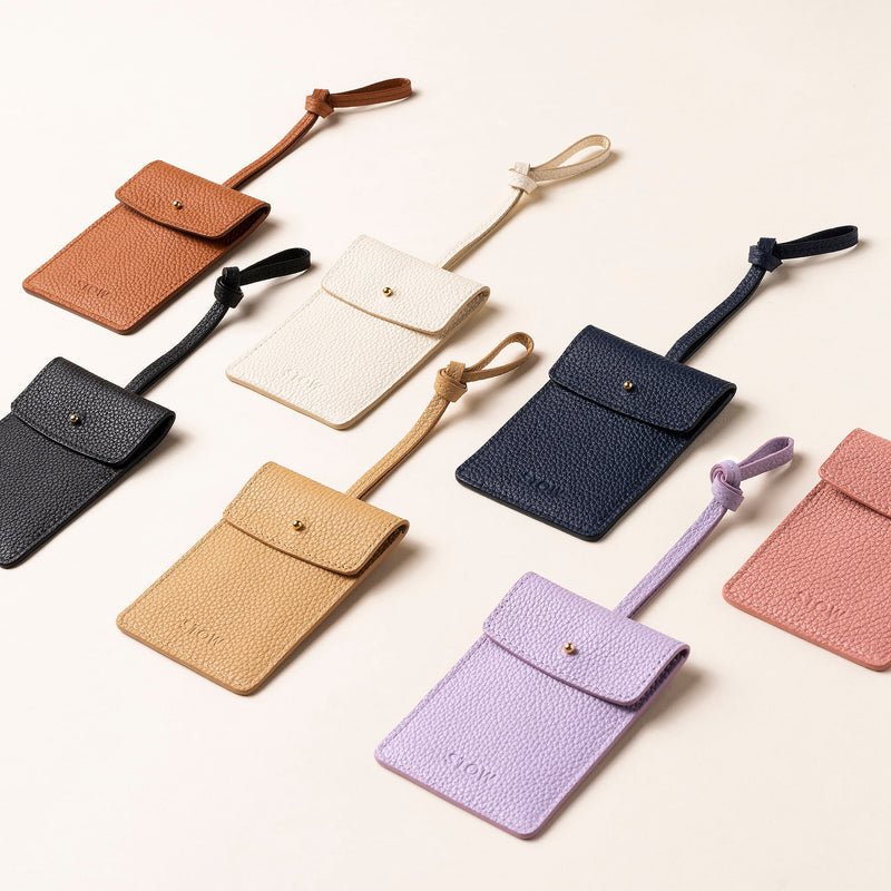 STOW London Leather Multi Tag in various colours laid out together.