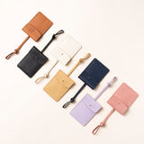 STOW Leather Multi Tag in various colours laid out together.