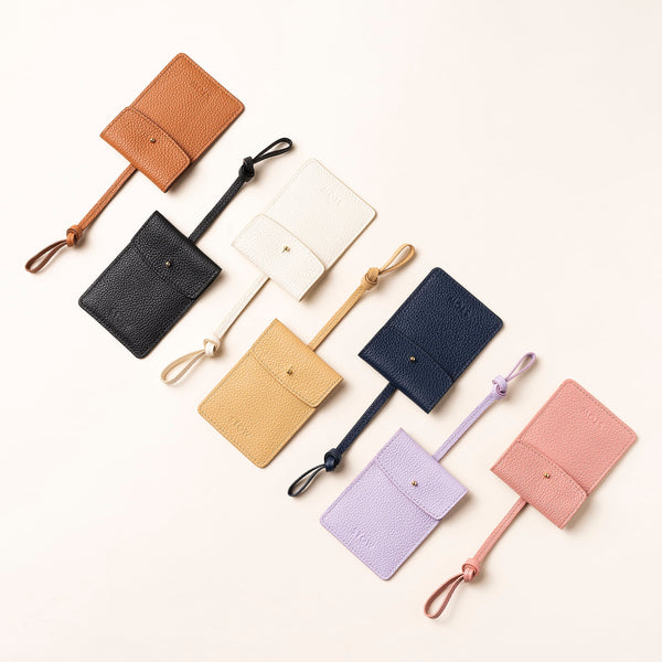 STOW Leather Multi Tag in various colours laid out together.