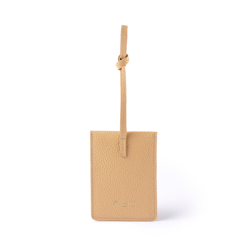 STOW Leather Multi Tag in Almond pebbled leather with personalised initials on the back.