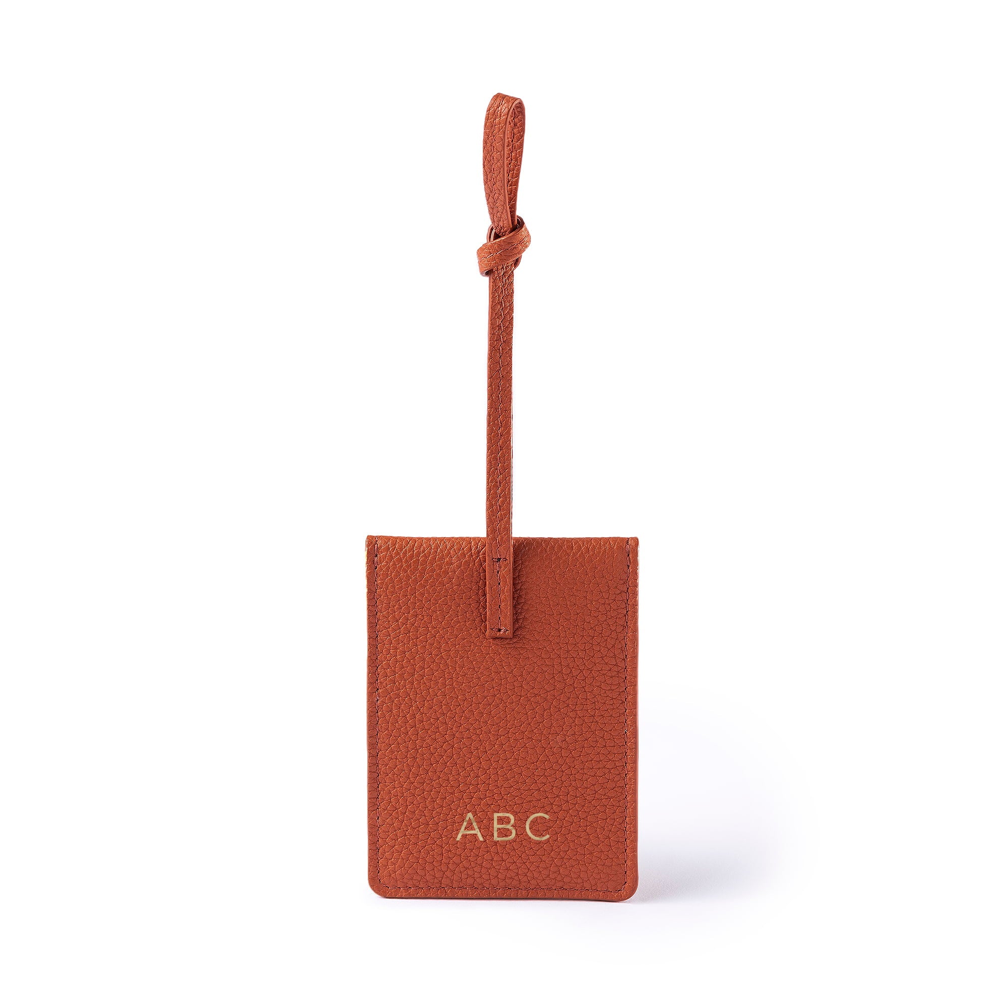 STOW London Leather Multi Tag in Clay Orange pebbled leather with personalised initials.