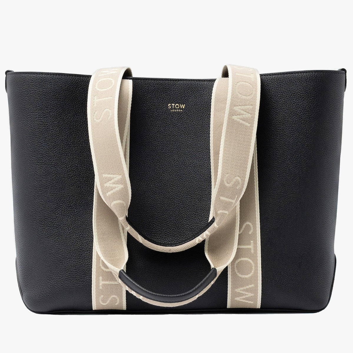 STOW London's Nastro Tote bag in Black pebbled leather with beige nastro handles featuring 'STOW' branding on a light grey background