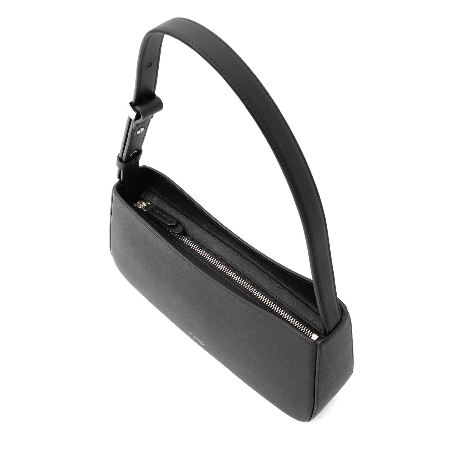 Top angled view of STOW London's Post Shoulder bag in Black smooth leather showing the bag's zip closure featuring silver hardware on a white background