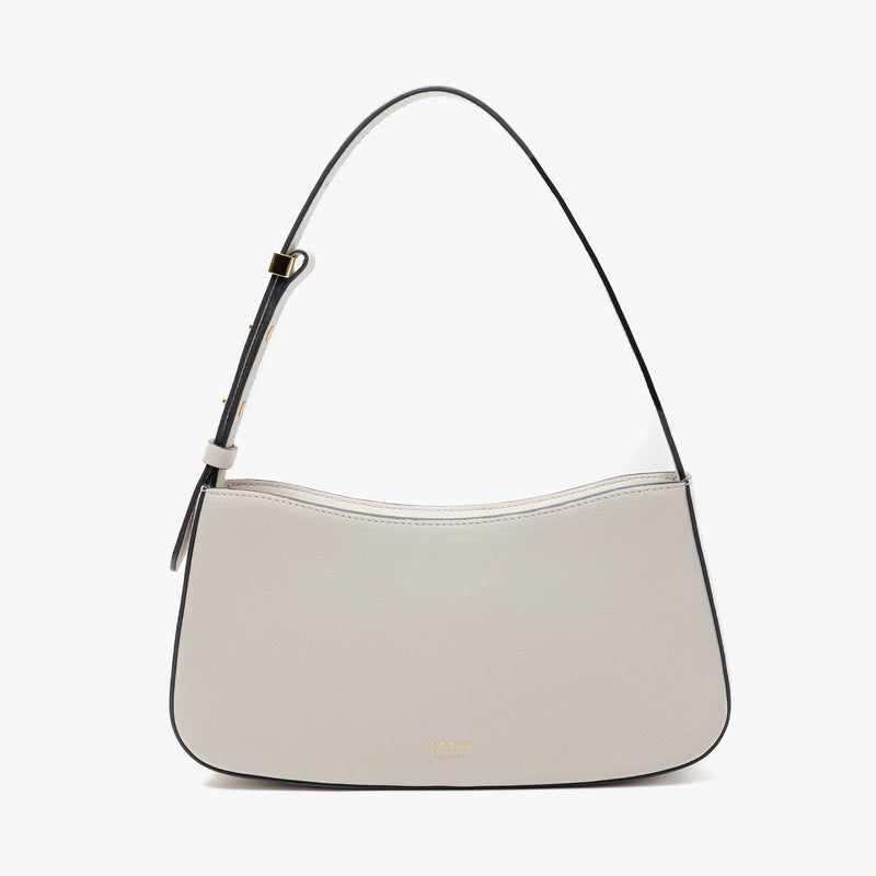 Stow London's Post Shoulder in Cloud Grey smooth leather on a light grey background featuring gold-coated stainless steel hardware