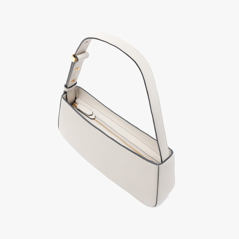 Stow London's Post Shoulder in Cloud Grey smooth leather on a light grey background featuring gold-coated stainless steel hardware and zip closure
