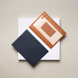 STOW Seeview Pouches in Navy and Earth Tan leather.