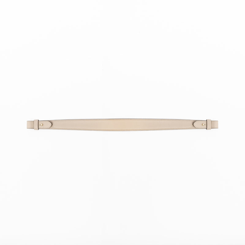 Detachable shoulder strap for STOW London's Curve, Midi Curve and East West in Camel smooth leather on a light grey background featuring gold hardware 