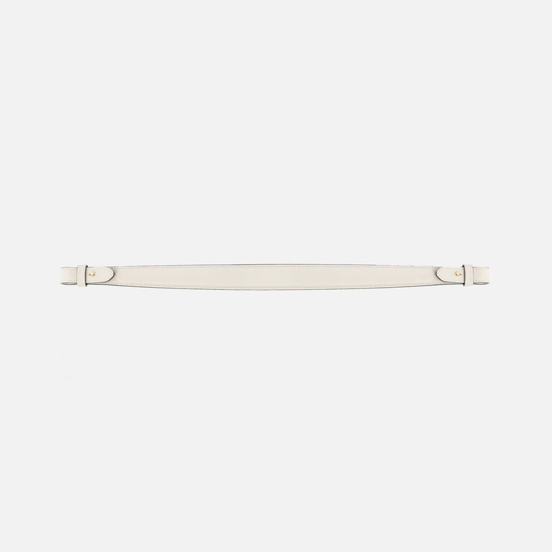Detachable shoulder strap for STOW London's Curve, Midi Curve and East West in Cloud Grey smooth leather on a light grey background featuring gold hardware 