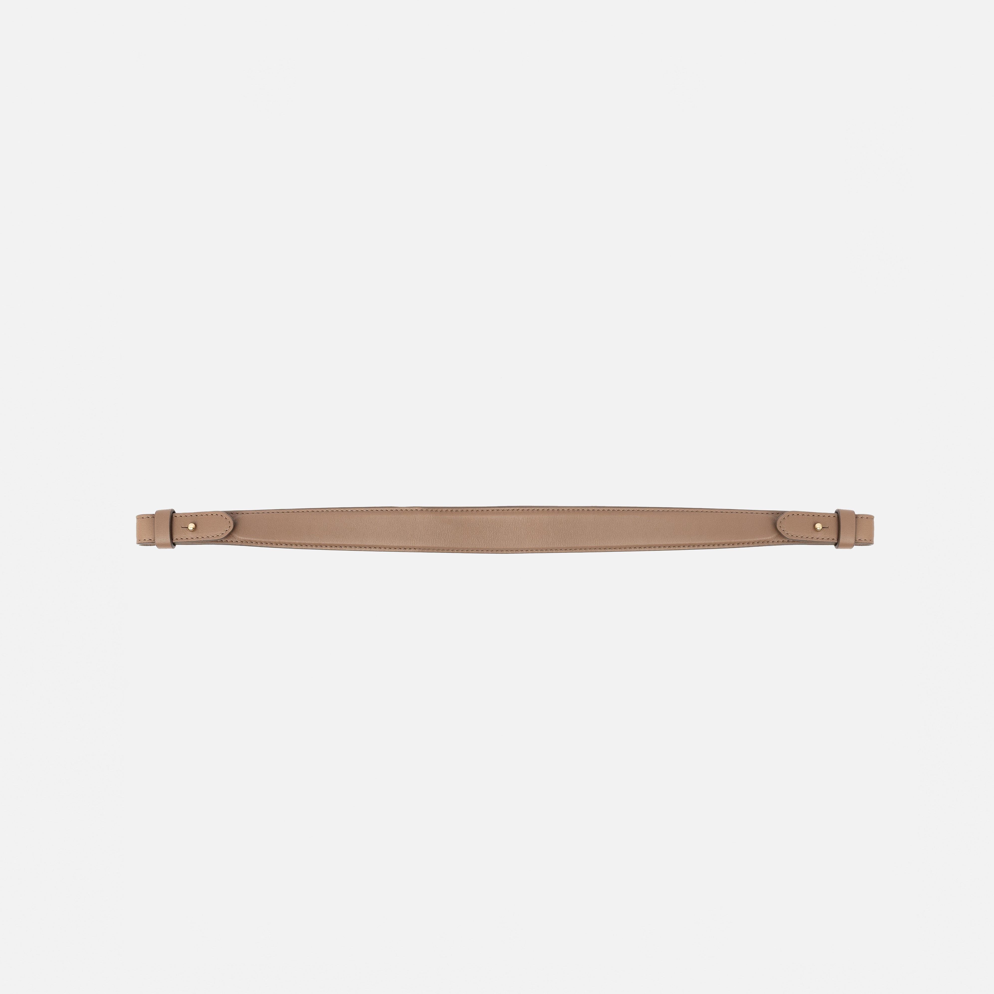 Detachable shoulder strap for STOW London's Curve, Midi Curve and East West in Mocha smooth leather on a light grey background featuring gold hardware 