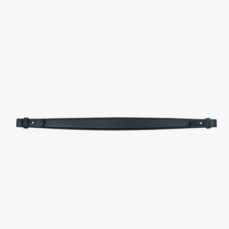 The detachable shoulder strap in New Forest smooth leather on a light grey background 