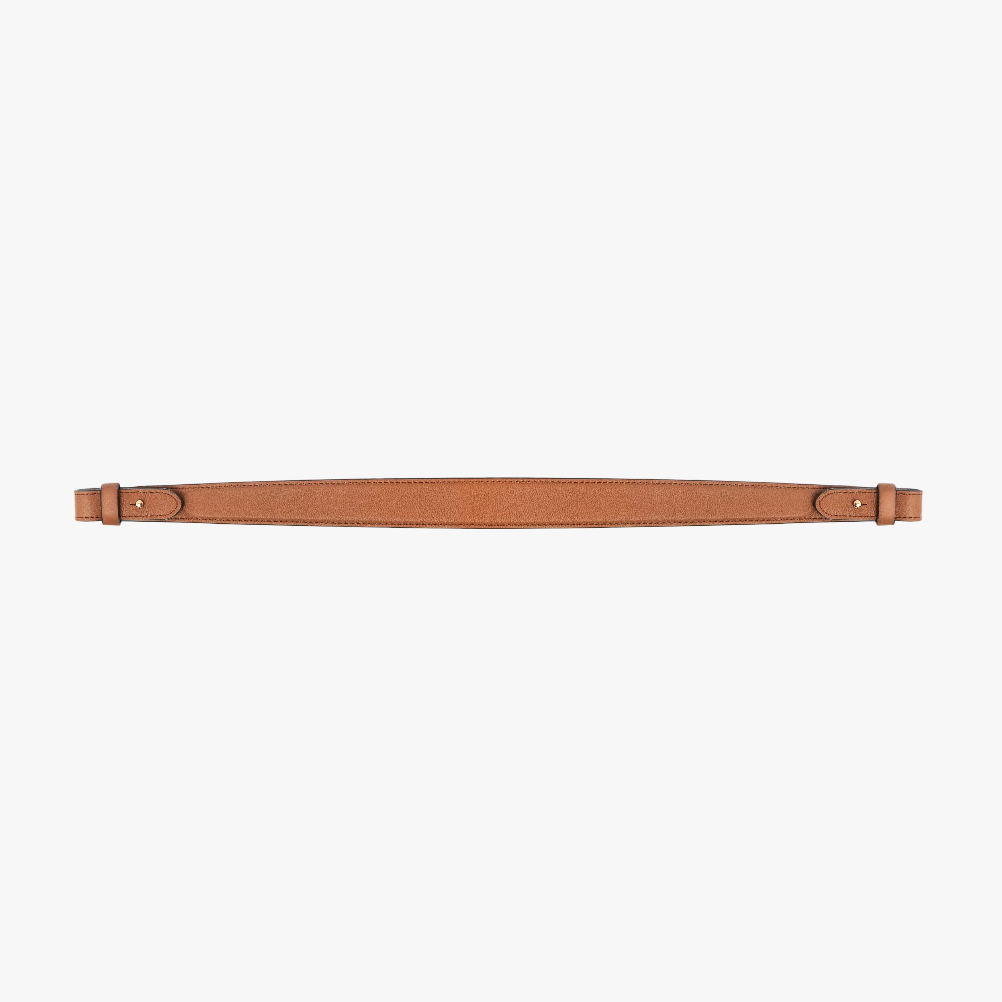 Detachable shoulder strap for STOW London's Curve, Midi Curve and East West in Earth Tan smooth leather on a light grey background featuring gold hardware 