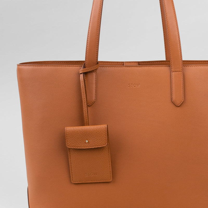 STOW Leather Multi Tag in Earth Tan pebbled leather shown hanging on Earth Tan Everyday Tote Bag by STOW.