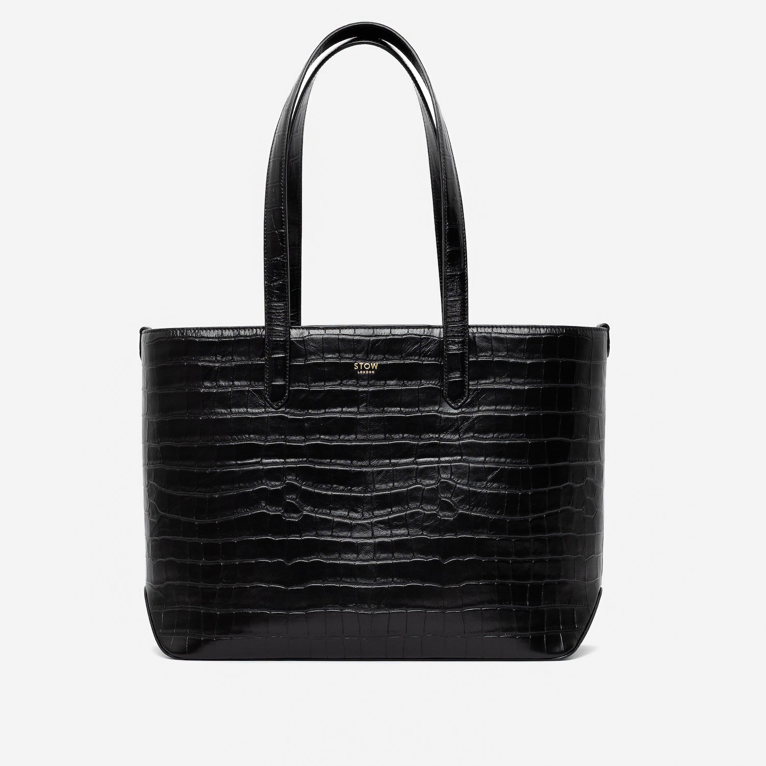 Stow London's Everyday Tote Bag in Black Embossed Croc leather on a light grey background featuring gold STOW logo