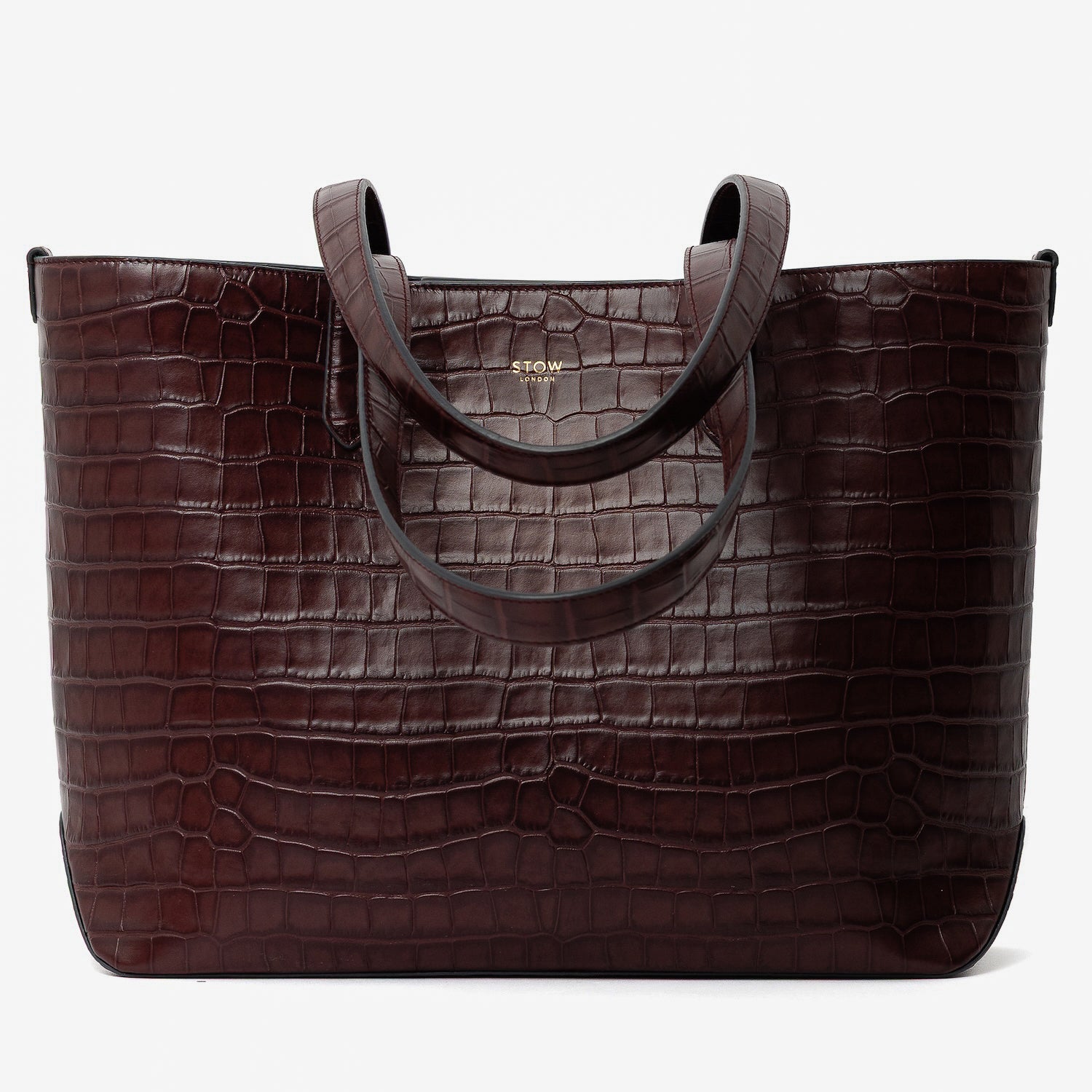 Stow London's Everyday Tote Bag in Burgundy Embossed Croc leather on a light grey background featuring gold STOW logo