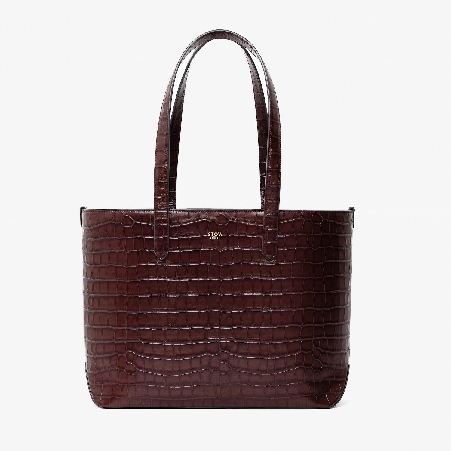 Stow London's Everyday Tote Bag in Burgundy Embossed Croc leather on a light grey background featuring gold STOW logo