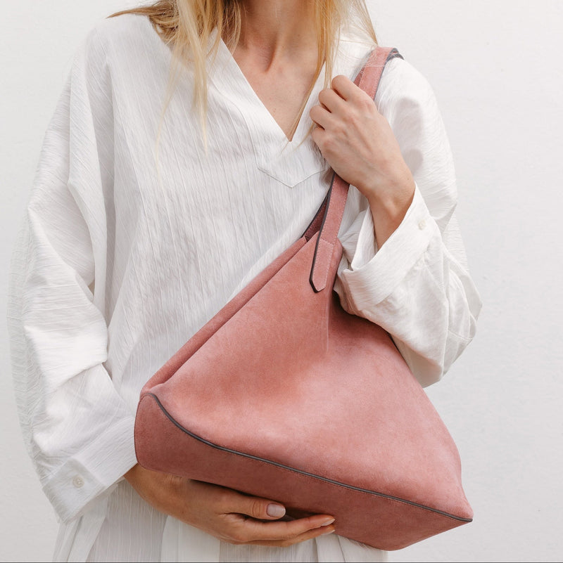 Model with STOW London's Everyday Tote bag in Hazy Blush suede