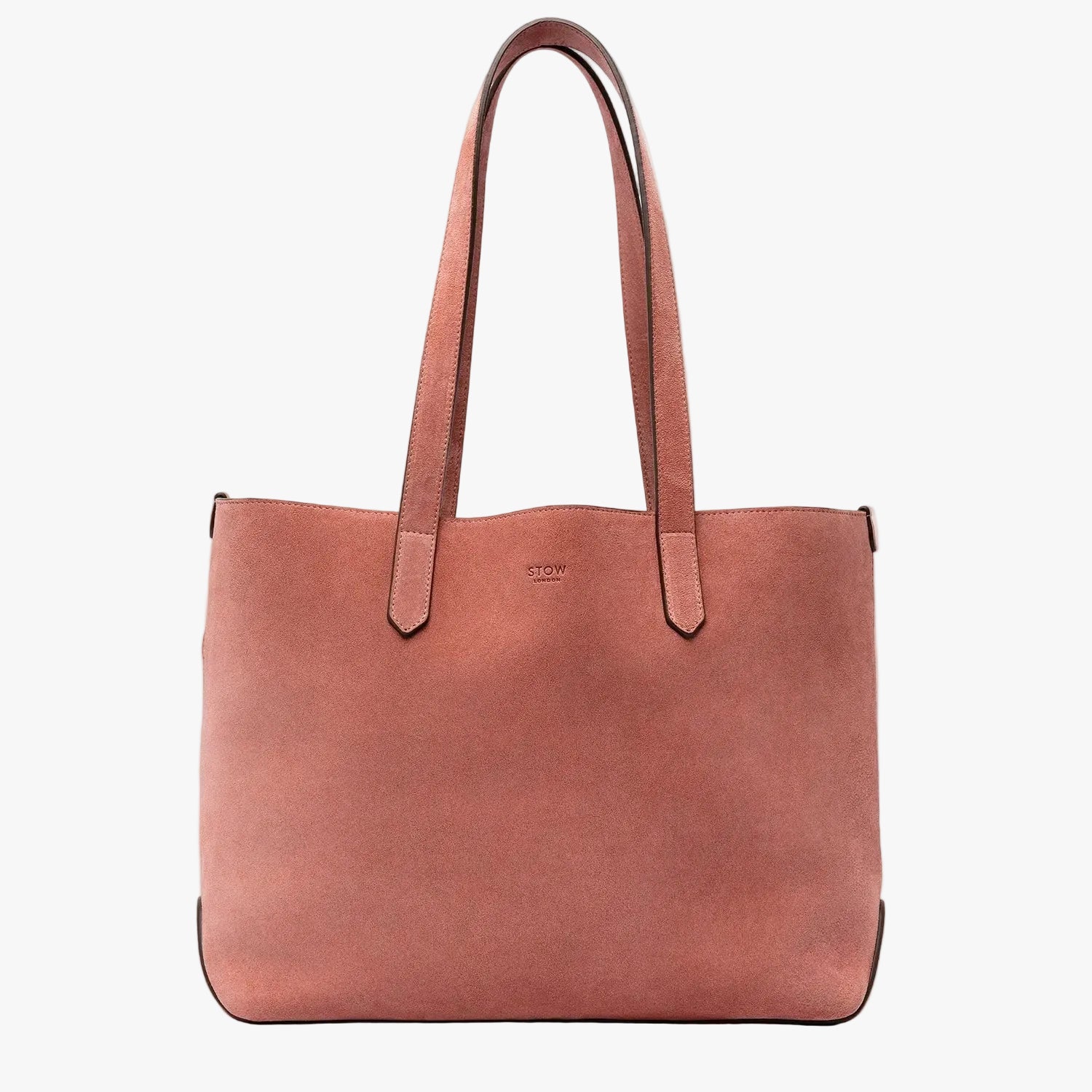 STOW London's Everyday Tote bag in Hazy Blush suede on a light grey background featuring a small STOW London logo embossed on the front panel 