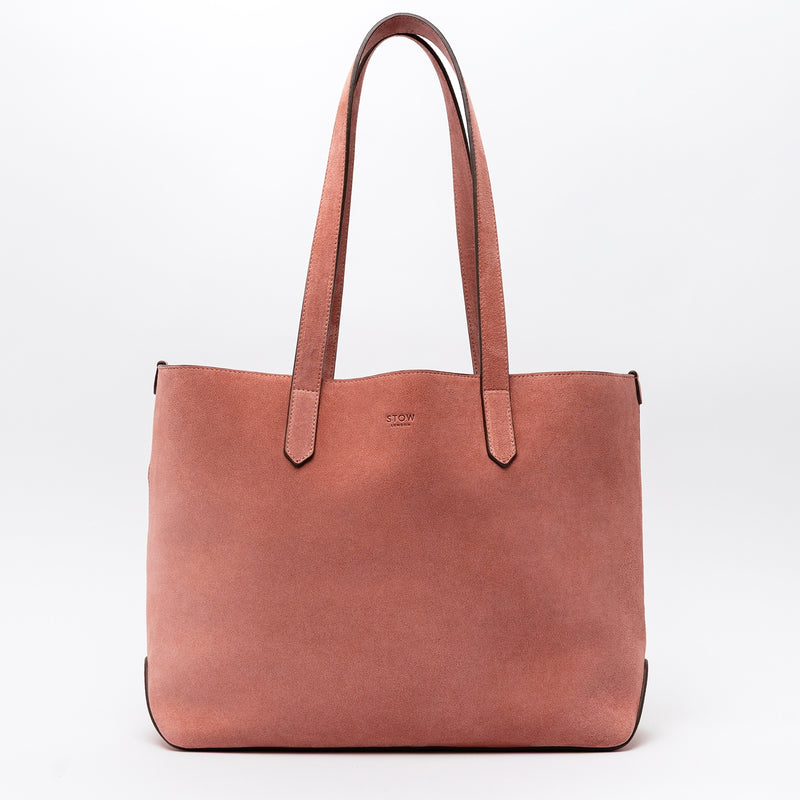 STOW London's Everyday Tote bag in Hazy Blush suede on a light grey background featuring a small STOW London logo embossed on the front panel 