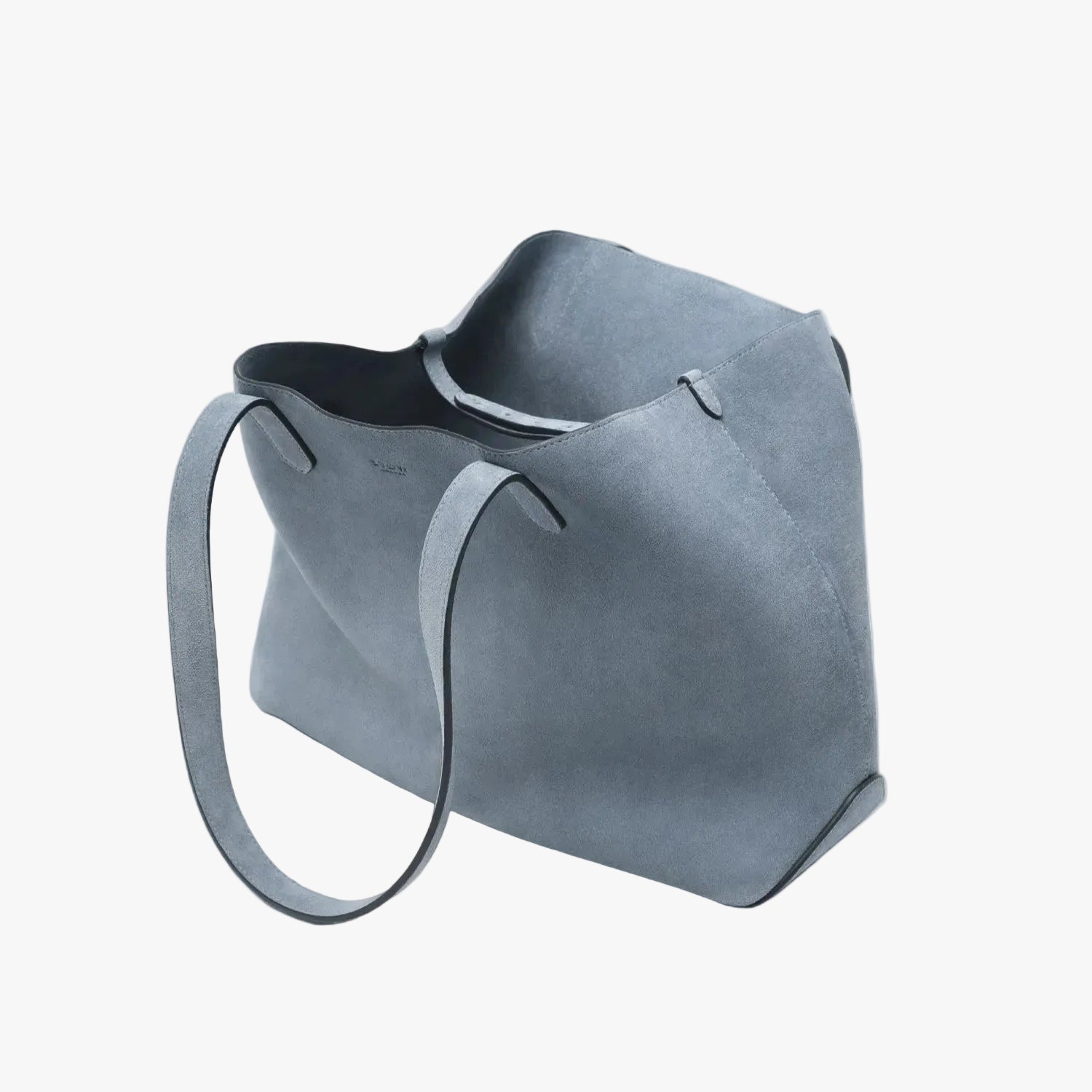 STOW London's Everyday Tote bag in Misty Blue suede on a light grey background featuring the interior strap and a small STOW London logo embossed on the front panel 