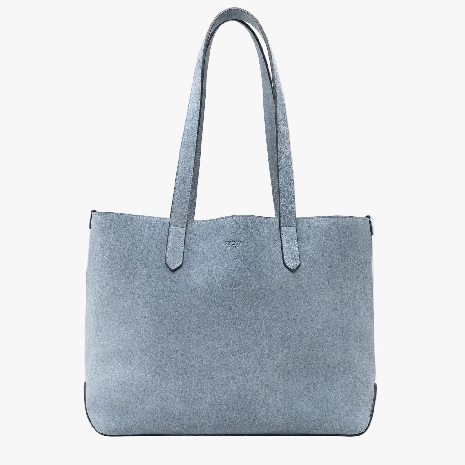 STOW London's Everyday Tote bag in Misty Blue suede on a light grey background featuring a small STOW London logo embossed on the front panel 