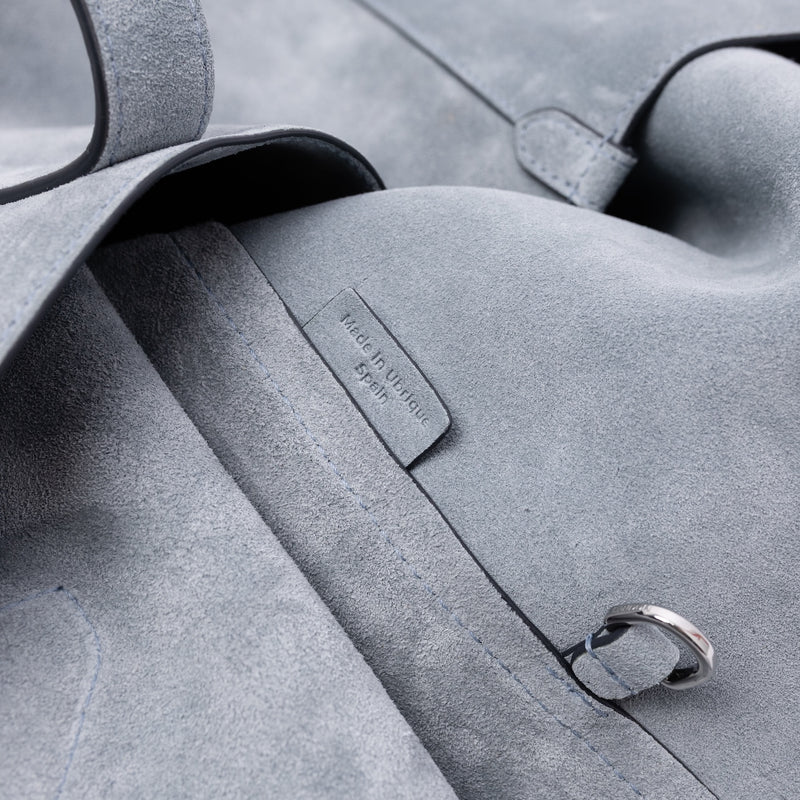 Close up of the interior d-ring and Made In Ubrique tag on STOW London's Everyday Tote bag in Misty Blue suede 