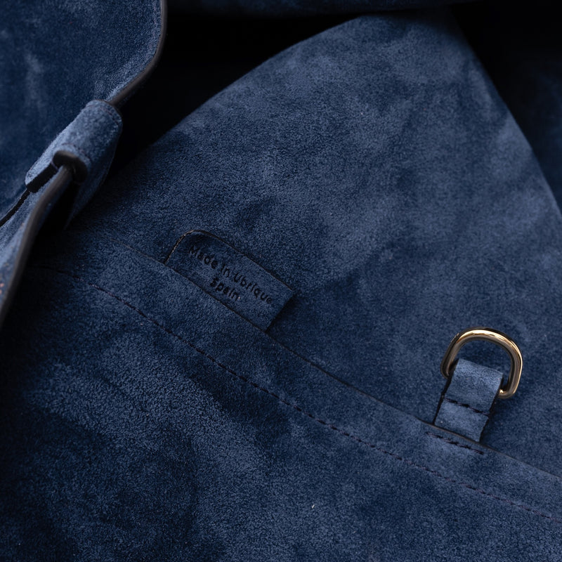 Close up of the suede interior on STOW London's Everyday Tote bag in Navy suede featuring the internal gold coated d-ring and made in Ubrique tag