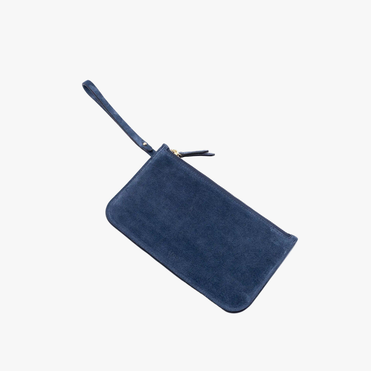 The matching, detachable internal zip pouch from STOW London's Everyday Tote bag in Navy suede on a light grey background featuring a small STOW London logo embossed on the front panel