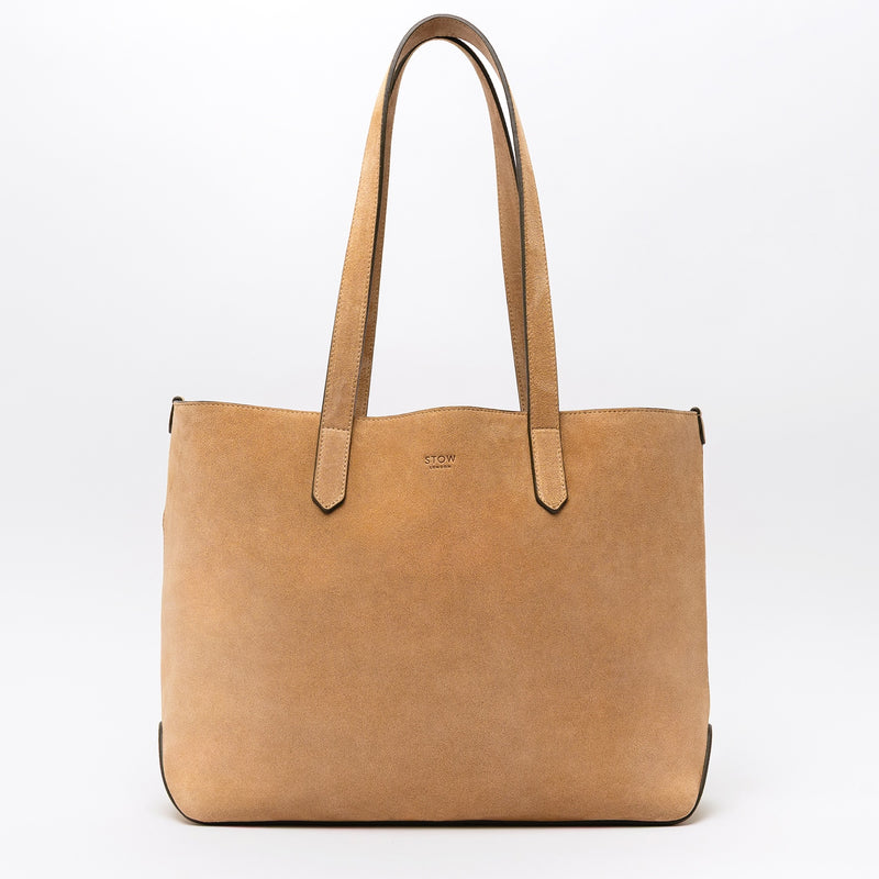 STOW London's Everyday Tote bag in Soft Sand suede on a light grey background featuring a small STOW London logo embossed on the front panel 